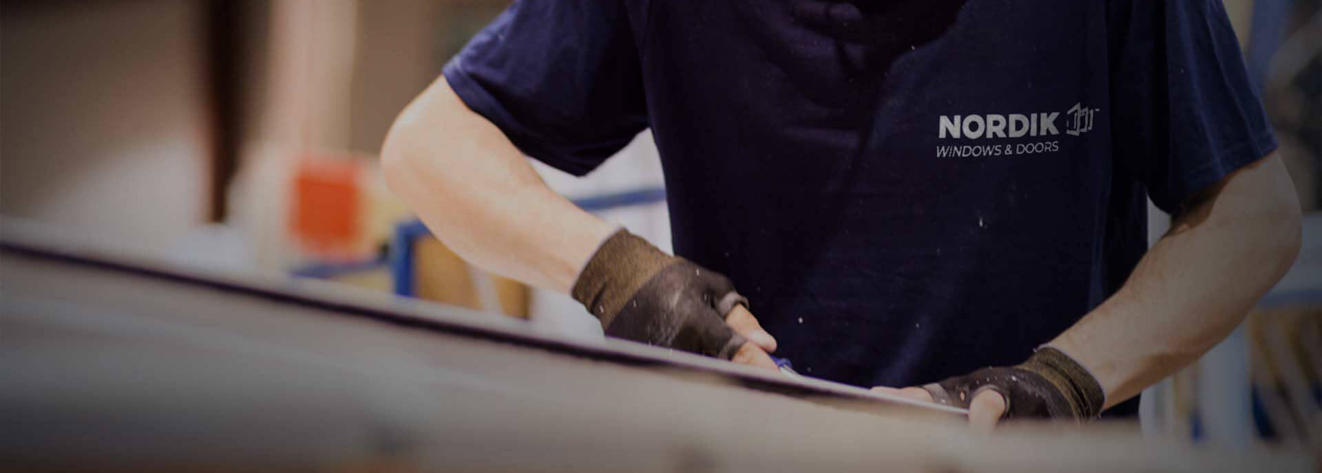 A Nordik window manufacturer working on a window.