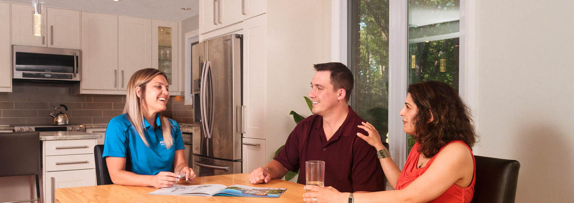 A Nordik representative answers questions during a free in-home window and door consultation.