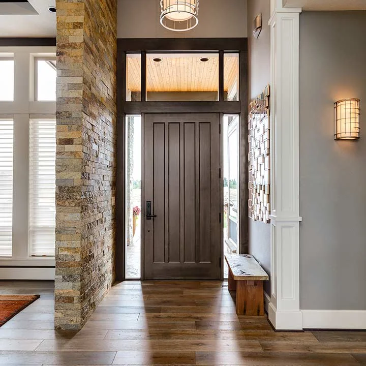 A replacement front entry door with a sidelite and triple glass inserts.