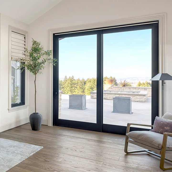 A pvc sliding patio door on a concrete patio.